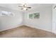 Cozy bedroom with ceiling fan and bright, natural light at 12063 E Arizona Dr, Aurora, CO 80012