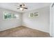 Comfortable bedroom with neutral walls, ceiling fan and natural light at 12063 E Arizona Dr, Aurora, CO 80012