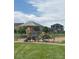 Community playground featuring modern equipment and a safe play area for children at 7702 E 157Th Ave, Thornton, CO 80602