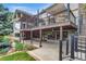 Expansive backyard featuring a multi-level deck and patio, perfect for outdoor entertaining and relaxation at 32 Glenmoor Dr, Englewood, CO 80113