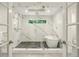 This bathroom boasts a glass shower with dual heads and a separate soaking tub at 32 Glenmoor Dr, Englewood, CO 80113