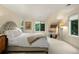 Bright bedroom featuring neutral colors and natural light at 32 Glenmoor Dr, Englewood, CO 80113