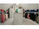Spacious closet with custom shelving, storage, and central island at 32 Glenmoor Dr, Englewood, CO 80113
