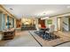 Open dining area with pendant lighting, adjacent to a kitchen bar, offers ample space for entertaining at 32 Glenmoor Dr, Englewood, CO 80113