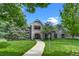 Charming home featuring an inviting walkway and well-maintained lawn at 32 Glenmoor Dr, Englewood, CO 80113