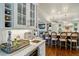 Chef's kitchen with marble countertops, wine storage, and an island with seating at 32 Glenmoor Dr, Englewood, CO 80113