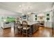 Bright, open-concept kitchen with a large island and seamless flow into the living area at 32 Glenmoor Dr, Englewood, CO 80113