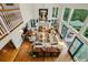 A bird's-eye view of the living room, with floor-to-ceiling windows and cozy seating at 32 Glenmoor Dr, Englewood, CO 80113