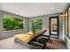Relaxing covered patio with daybeds and lovely green views at 32 Glenmoor Dr, Englewood, CO 80113