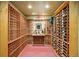 Spacious wine cellar featuring extensive wooden racks for ample bottle storage and display at 32 Glenmoor Dr, Englewood, CO 80113