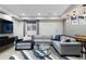 Open basement layout featuring a comfortable seating area and entertainment center with a window at 7106 Cerney Cir, Castle Pines, CO 80108