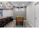 Finished basement boasts a foosball table on a decorative rug, perfect for recreation at 7106 Cerney Cir, Castle Pines, CO 80108