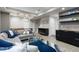Finished basement showcasing a seating area, entertainment center, and wet bar, creating a multi-functional space at 7106 Cerney Cir, Castle Pines, CO 80108