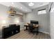 Finished basement offers a dedicated office space with built-in shelves and ample natural light at 7106 Cerney Cir, Castle Pines, CO 80108