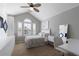 Inviting bedroom features a large window, vaulted ceiling, and ample closet space at 7106 Cerney Cir, Castle Pines, CO 80108