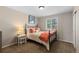 Cozy bedroom with a comfortable bed, natural light, carpet flooring, and calming decor, creating a peaceful retreat at 7106 Cerney Cir, Castle Pines, CO 80108