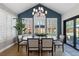 Dining room featuring natural lighting, modern decor, stylish furniture, with a beautiful view of the outdoor landscape at 7106 Cerney Cir, Castle Pines, CO 80108