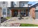 Welcoming front porch with seating, lovely landscaping, and a charming entrance, perfect for greeting guests at 7106 Cerney Cir, Castle Pines, CO 80108