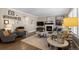 Comfortable living room showcasing a fireplace, stylish decor, neutral tones, and hardwood floors, offering a warm ambiance at 7106 Cerney Cir, Castle Pines, CO 80108