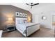 Spacious main bedroom featuring a ceiling fan, bedside tables, and neutral walls at 7106 Cerney Cir, Castle Pines, CO 80108