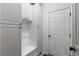Functional mud room with built-in storage cabinets, seating, and easy access to the home's interior at 7106 Cerney Cir, Castle Pines, CO 80108