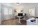 Bright office space featuring a white desk, chair, and a large window at 7106 Cerney Cir, Castle Pines, CO 80108