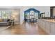 Bright open-concept living space featuring a living room, dining area with large windows, and a modern kitchen at 7106 Cerney Cir, Castle Pines, CO 80108