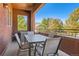 Private balcony featuring an outdoor dining set, offering a great space to enjoy fresh air and views at 535 Elmhurst Way # A, Highlands Ranch, CO 80129