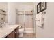 Bathroom showcasing a glass-enclosed shower, vanity with sink, and modern fixtures, providing a clean and functional space at 535 Elmhurst Way # A, Highlands Ranch, CO 80129