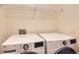 Well-lit laundry room featuring modern LG washer and dryer and wire shelving for storage at 535 Elmhurst Way # A, Highlands Ranch, CO 80129