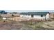 Large fenced backyard with a fire pit area and low-maintenance landscaping offering a private outdoor retreat at 32350 E 137Th Way, Brighton, CO 80603