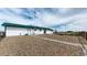Spacious backyard with a rock area and gated fencing providing a secure and versatile outdoor space at 32350 E 137Th Way, Brighton, CO 80603