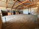 Interior view of a horse barn with multiple stalls and durable flooring at 32350 E 137Th Way, Brighton, CO 80603