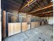 Well-maintained horse barn featuring several wooden stalls with metal gates at 32350 E 137Th Way, Brighton, CO 80603