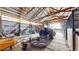Spacious barn interior with a tractor, equipment, and ample storage at 32350 E 137Th Way, Brighton, CO 80603