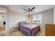Comfortable bedroom featuring a ceiling fan, window with blinds, and cozy decor for a peaceful retreat at 32350 E 137Th Way, Brighton, CO 80603