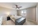 A bedroom offering a calm space with a ceiling fan, neutral colors, and plenty of natural light from the window at 32350 E 137Th Way, Brighton, CO 80603