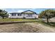 Charming single-story home with a welcoming front porch, well-manicured lawn, and inviting curb appeal at 32350 E 137Th Way, Brighton, CO 80603