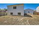 Fenced backyard offering a serene outdoor space, garage, and mature landscape at 4600 Dillon St, Denver, CO 80239