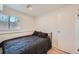 Comfortable bedroom with natural light, wood floors, and a closet for storage at 4600 Dillon St, Denver, CO 80239