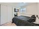 Cozy bedroom with a large window, closet, and a TV for your entertainment at 4600 Dillon St, Denver, CO 80239