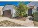 Inviting home exterior with tidy landscaping, an attached two-car garage and a cozy front porch at 4600 Dillon St, Denver, CO 80239