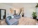 Stylish living area with an open layout, comfortable seating, and views into the dining space at 4600 Dillon St, Denver, CO 80239