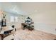 Finished basement area with multiple work stations that can be used as a home office or gym at 4600 Dillon St, Denver, CO 80239
