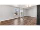 Bedroom with hardwood floors, mirrored closet doors, and a nice view at 2 Adams St # 1504, Denver, CO 80206