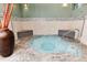 Cozy hot tub featuring modern tile work at 2 Adams St # 1504, Denver, CO 80206