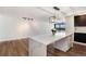 Kitchen island boasts a white countertop and view from windows overlooking city and mountains at 2 Adams St # 1504, Denver, CO 80206