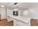 Kitchen island boasts a white countertop with drawers, and a stylish light fixture at 2 Adams St # 1504, Denver, CO 80206