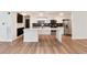 Open concept kitchen with a large island, stainless steel appliances, and sleek cabinetry at 2 Adams St # 1504, Denver, CO 80206