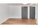 Cozy living room featuring wood-look floors, neutral paint, and closet at 2 Adams St # 1504, Denver, CO 80206